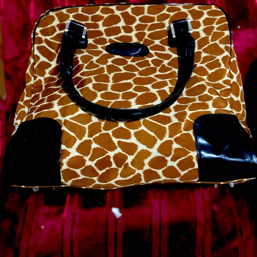 Overnight bag, camel print black handles good condition.